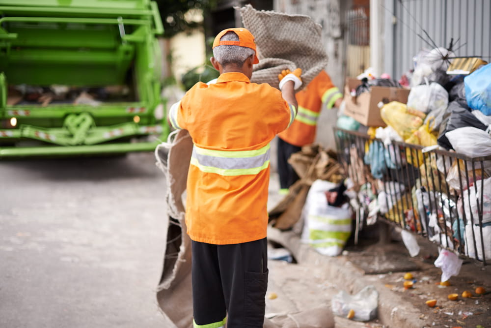 garbage-collectors-working-on-an-urban-street-2026-03-25-02-23-12-utc.jpg
